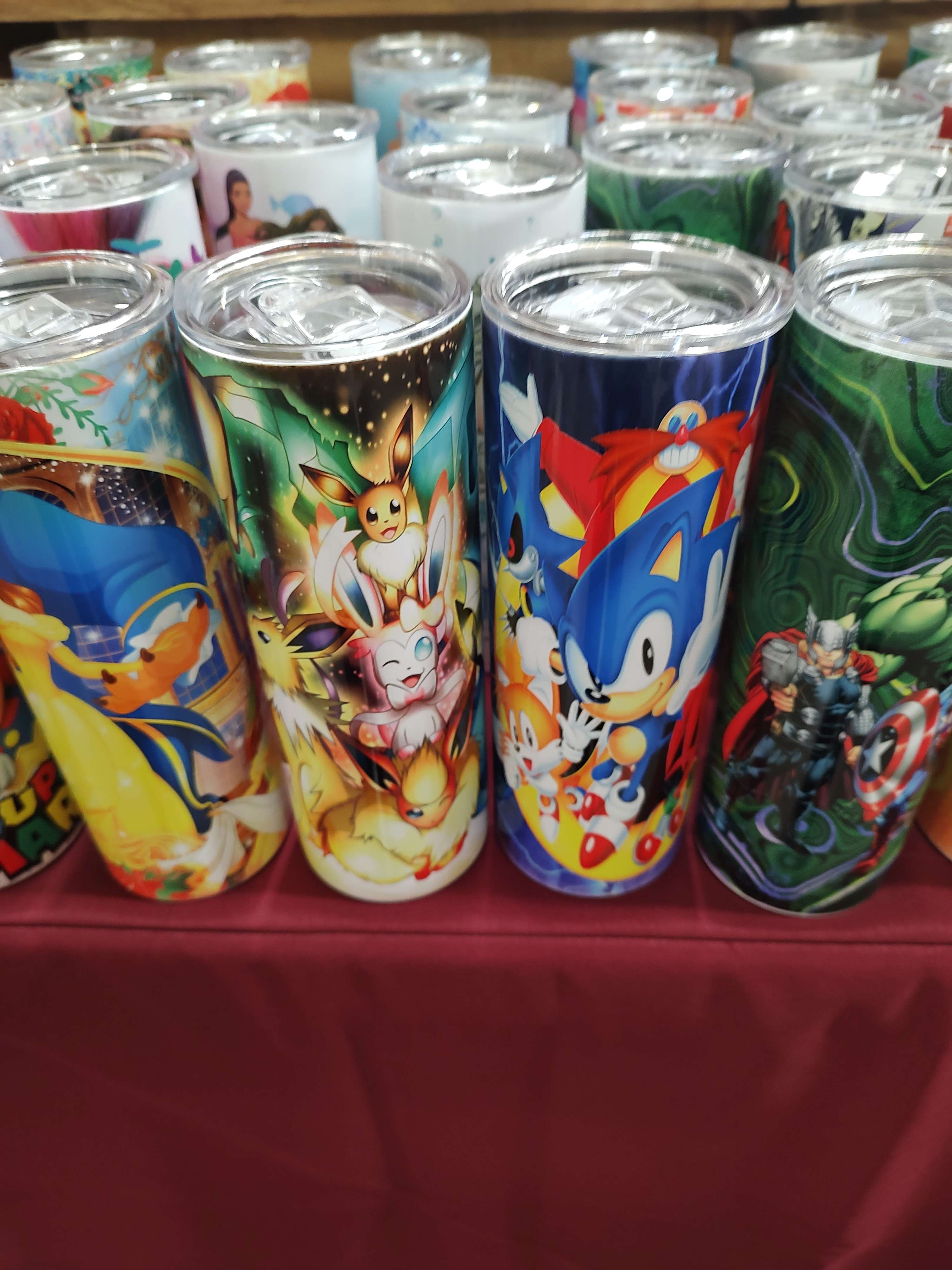 metal water bottles featuring horrifically stretched stolen pokemon fan art and sonic origins official art